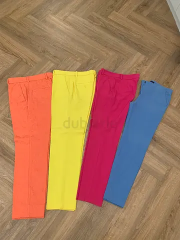 Four pairs of women's colored slim-fit trousers - size XS and S.