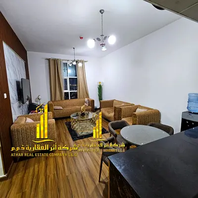 Luxury apartment, second occupancy, one bedroom, living room with open balcony. Ajman City Tower. Fully furnished, for monthly rent.