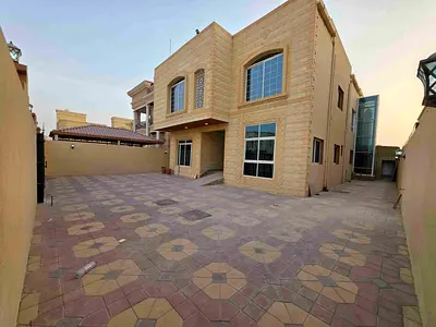 For sale: Villa - Two floors, roof, and large courtyard with an internal elevator - Close to Sheikh Mohammed bin Zayed Road - Freehold for all nationa