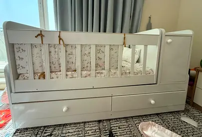 White Baby Crib with Attached Dresser and Bedding - Good Condition