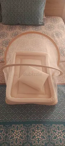 Baby bed in bed with mosquito net