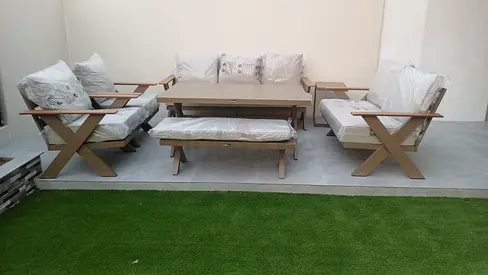 Outdoor wooden patio seating set with coffee table and cushions - 6 pcs