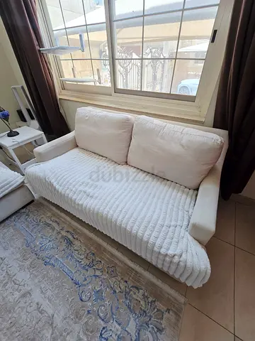 Light beige 2-seater sofa in good condition. X2