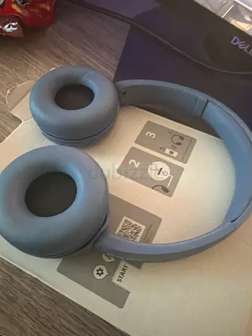 Pair of over-ear wireless headphones – light blue, never used