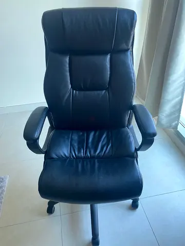 Black leather reclining office chair with footrest — good condition