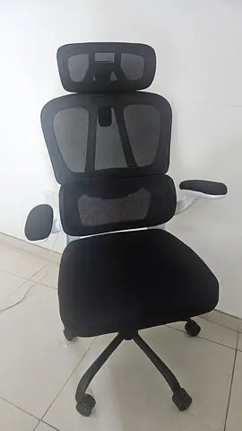 Black ergonomic  chair with adjustable headrest