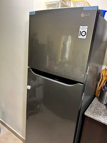 LG top-freezer refrigerator in good condition - 2 doors, stainless look
