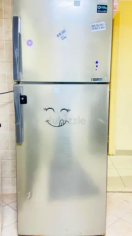 Well-maintained silver double-door refrigerator - good working condition