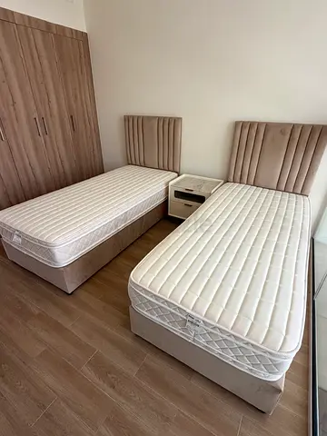1 single bed with mattresses and upholstered headboards - good condition