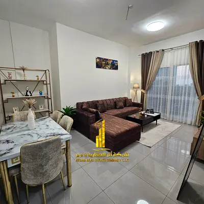 Luxury apartment, second occupancy. Two bedrooms, living room, and open balcony. Ajman, Al Rawda 2. Fully furnished for monthly rent.