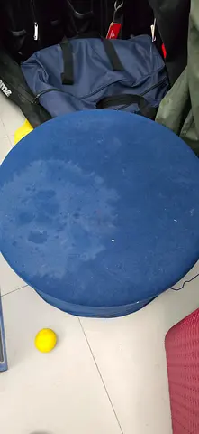 Blue round padded stool / ottoman - used