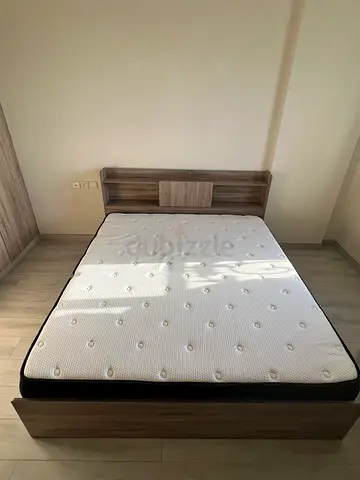 King bed frame (180cm) with mattress and attached headboard shelf - good condition