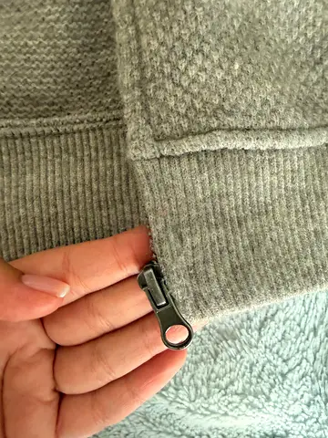 A sweater with a zipper.