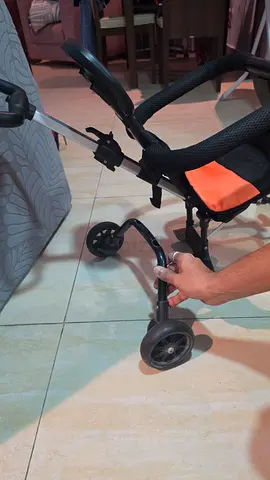 Lightweight orange baby stroller - compact foldable, rear wheel need repair