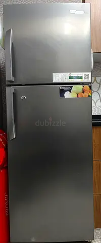 Silver double-door refrigerator, good working condition