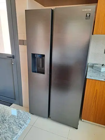 Samsung new model fridge side by side freezer digital water dispenser auto ice maker like new condit