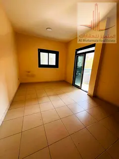 One-bedroom apartment with a living room and balcony in Al Rashidiya 3 area, very prime location, fa