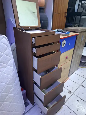 Tall chest of drawers / dresser with multiple drawers - good condition