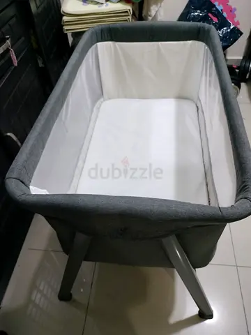 Light grey bedside bassinet / cradle in good condition