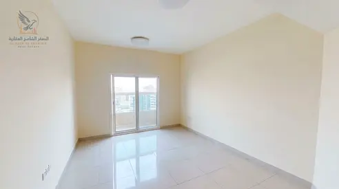 A prime residential opportunity for annual rent in Ajman a one-bedroom apartment with a living room two bathrooms built-in wardrobes a balcony