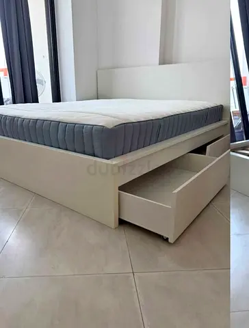 IKEA Malam King size bed with New mattress neat and clean available