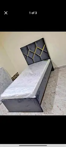 Single upholstered bed with decorative headboard - good condition