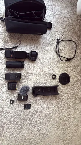 DJI Osmo Pocket + accessories (charger, batteries, SD cards)