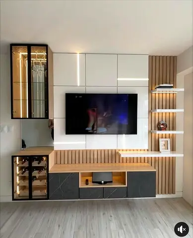 Modern wall-mounted entertainment unit with integrated wine rack and LED lighting