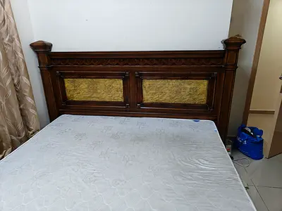 Queen wooden bed frame with carved headboard (used)