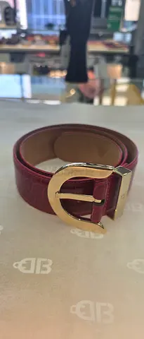 Red leather belt with gold buckle - gently used