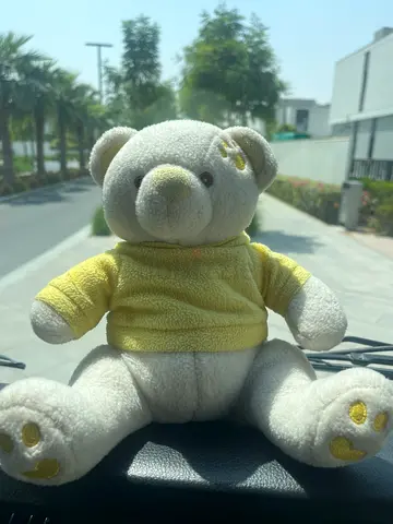 Small soft elephant plush toy in white and yellow - good condition