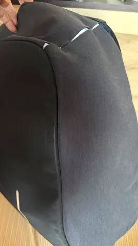 Used grey backpack with minor wear — good everyday bag