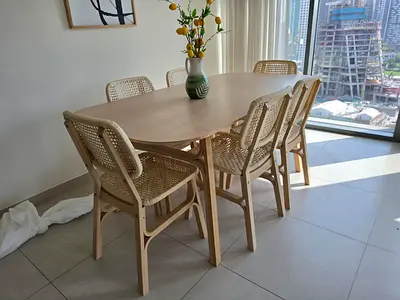 Light Wood Dining Table with 6 Rattan Chairs - Good Condition