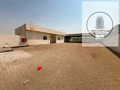 10,000 Sq Ft Yard with Offices Shelter & 20 kW in Sajaa Industrial