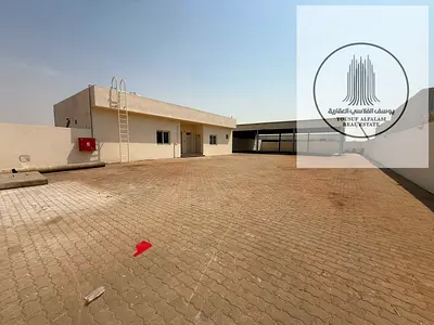 10,000 Sq Ft Yard with Offices Shelter & 20 kW in Sajaa Industrial