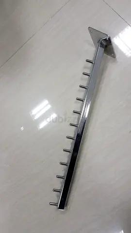 Wall-mounted chrome slatwall hook arm with 10 pegs