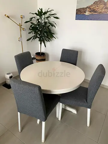 White round dining table with 4 grey upholstered chairs - perfect condition