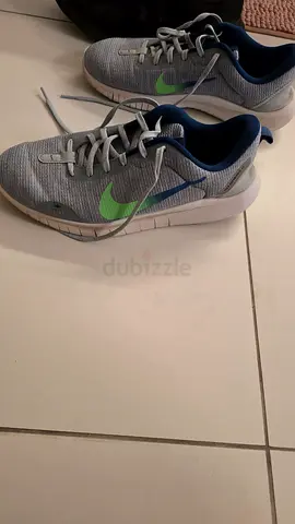 Men's Nike running shoes, light grey with green swoosh, used