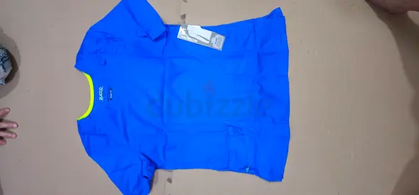Blue medical scrub top, new with tags - size not specified