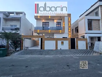 For sale in Al Yasmeen, Ajman: a five-bedroom villa featuring a separate majlis and a living room.