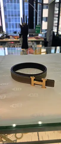 Brown leather belt with gold H buckle - good condition