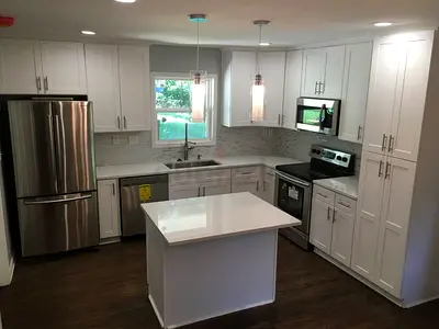 Modern white kitchen island with marble top