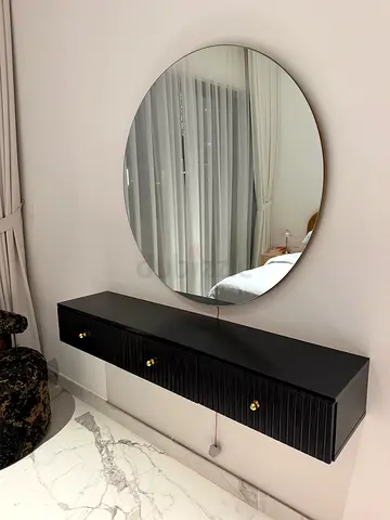 Custom wall-mounted black floating console with round mirror - modern