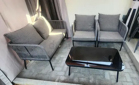 Outdoor 3-piece grey rattan-style sofa set with coffee table - good condition and Gazebo