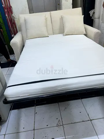 Off-white Fabric Sofa Bed with Cushions - Good Condition