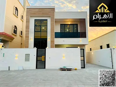 6-bedroom villa in Al Yasmeen featuring master bedrooms, two floors, and a roof terrace; freehold ownership available to all nationalities.