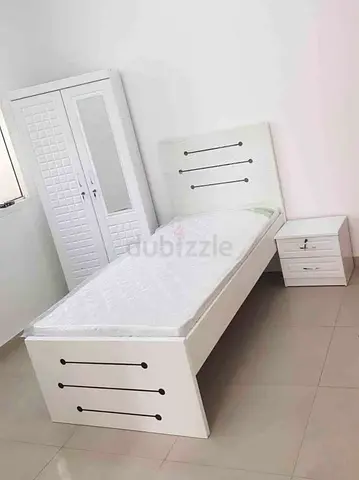 New White single bed with mattress, wardrobe and bedside table