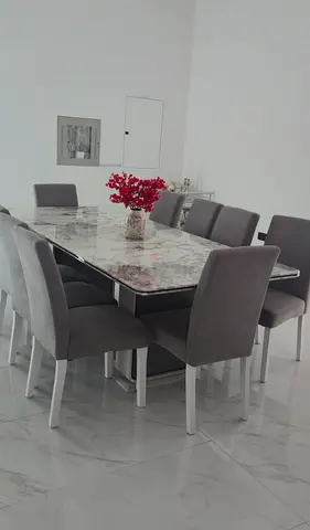 Marble-design  dining table with 10 upholstered chairs - excellent condition.