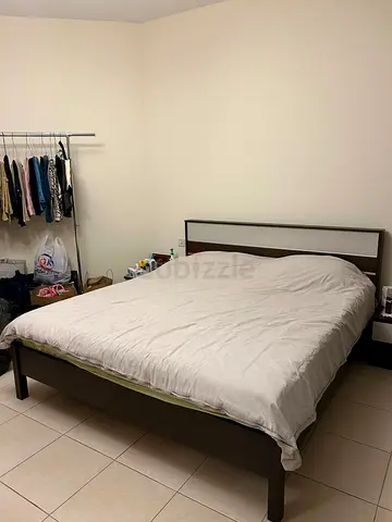 Queen size wooden bed frame with headboard - good condition