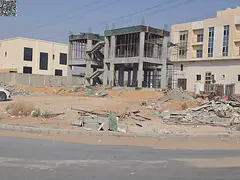 Corner plot for sale in a residential street, 4200 sq ft, in a prime location in Al-Haliou 2 area.
